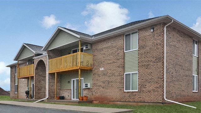a brick building with a balcony on the side