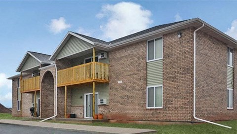 a brick building with a balcony on the side