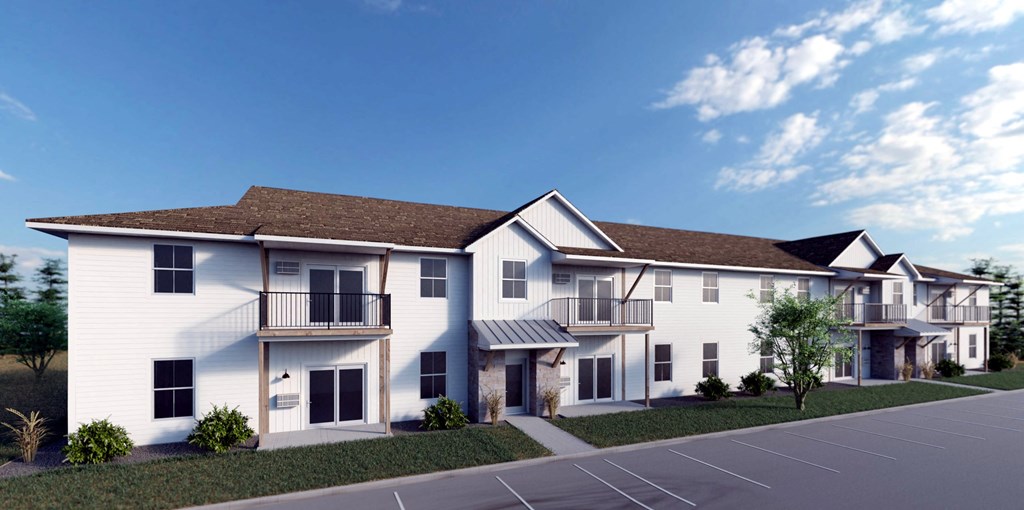 a rendering of an apartment building with a parking lot