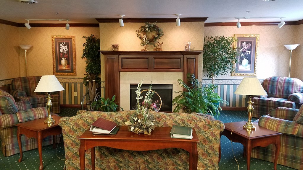 a living room with a couch and a fireplace
