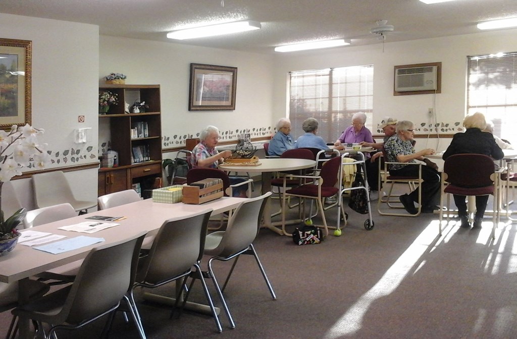 a group of people sitting at tables in a room