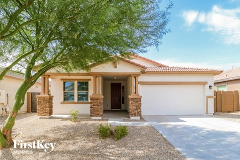 a house with a tree in front of it