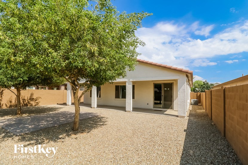 a small house with a tree in front of it