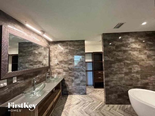 a bathroom with a sink and a large mirror