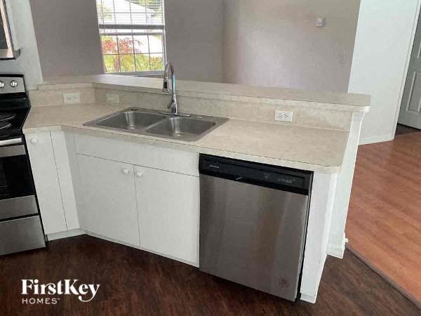a kitchen with a sink and a dishwasher