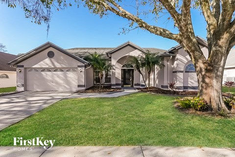 a house with palm trees in front of it