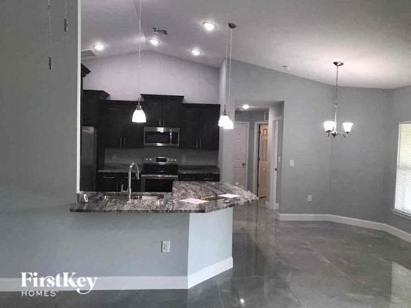 a kitchen with a marble counter top in a house