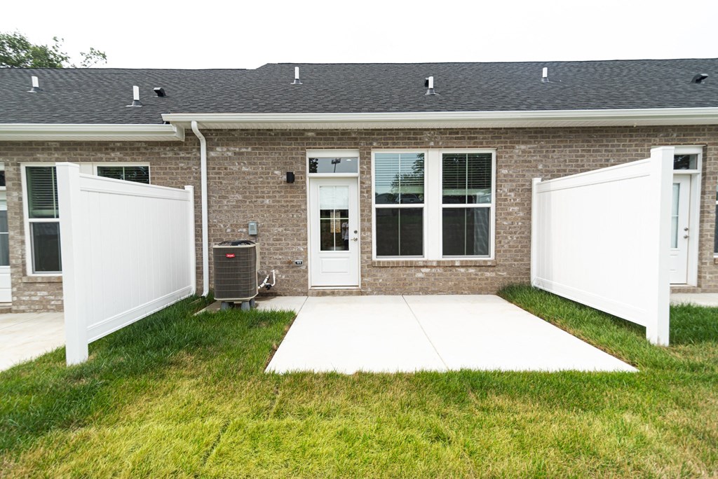 the front of a house with two white doors