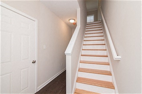 a staircase in a house with a white door