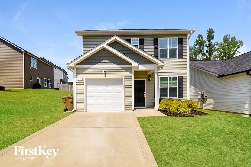 A house with a garage is for sale by FirstKey Homes.