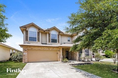 a house with a driveway and a garage door