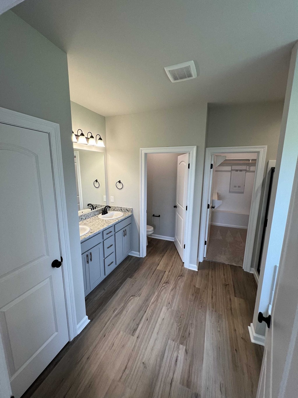 a view of a bathroom with a sink and a mirror