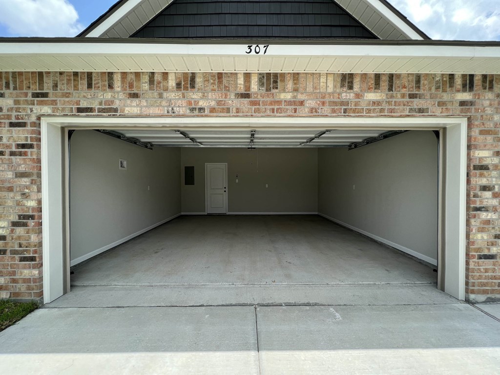 the garage at the end of a driveway