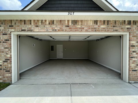 the garage at the end of a driveway
