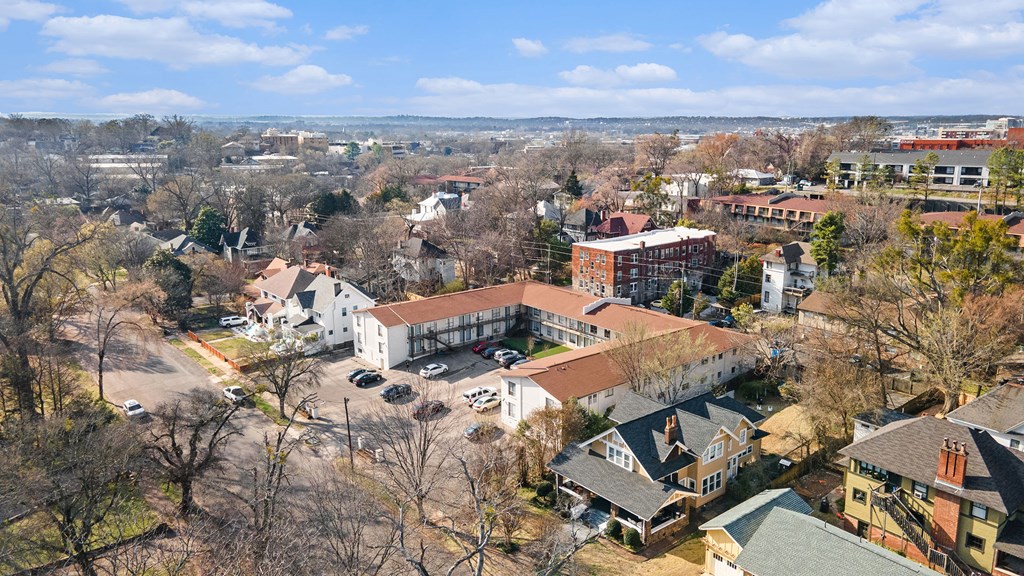 an aerial view of a city with buildings and trees