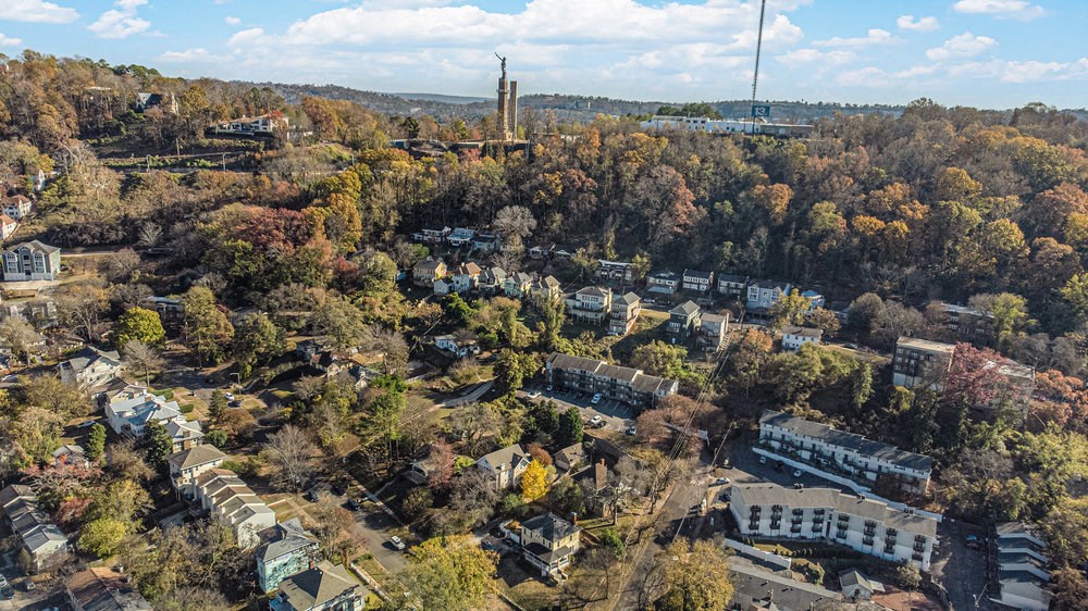 an aerial view of a city with trees and buildings