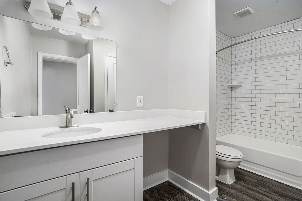 an empty bathroom with a sink and a toilet