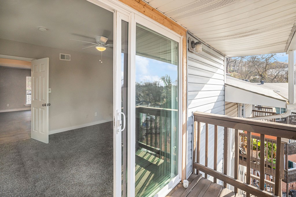the view from the deck of a home with a large glass door