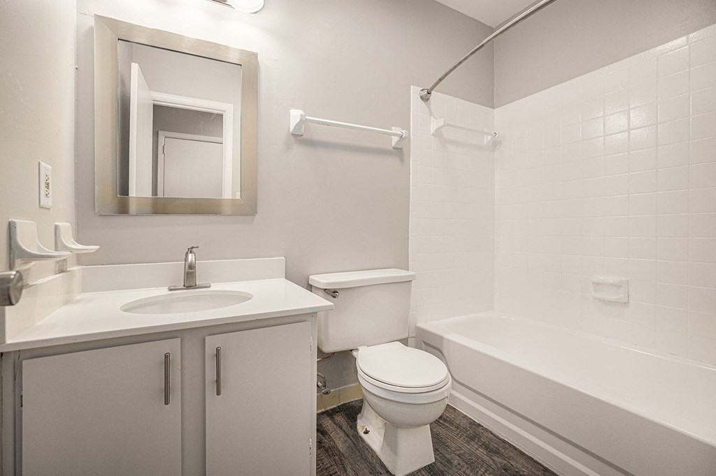 an empty bathroom with a sink toilet and bath tub