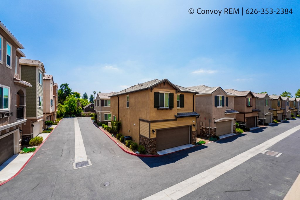 an empty street with rows of town houses