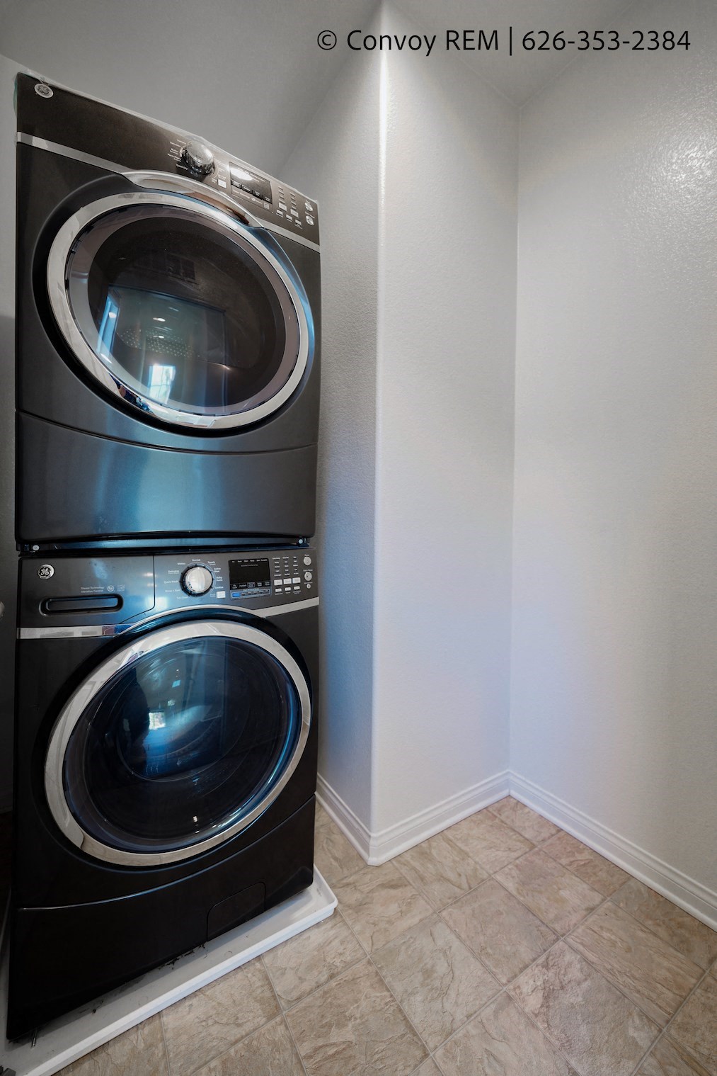 a front loading washer and dryer in a laundry room