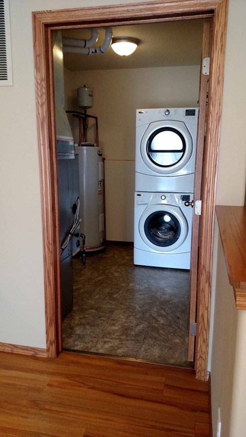 A view into a laundry room with a washer and dryer.