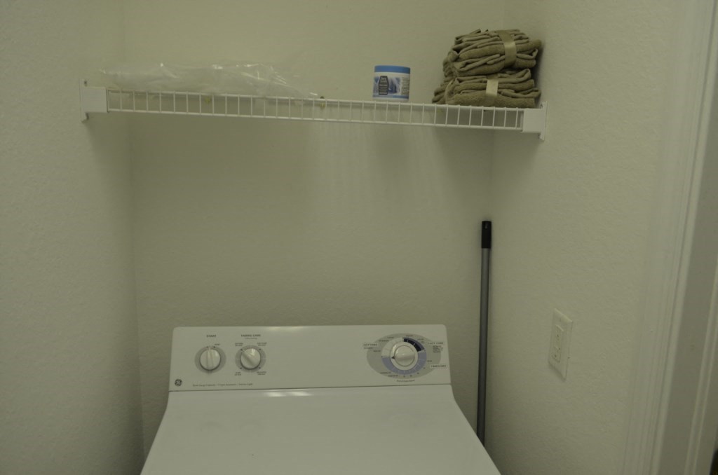 a white washer and dryer in a white room