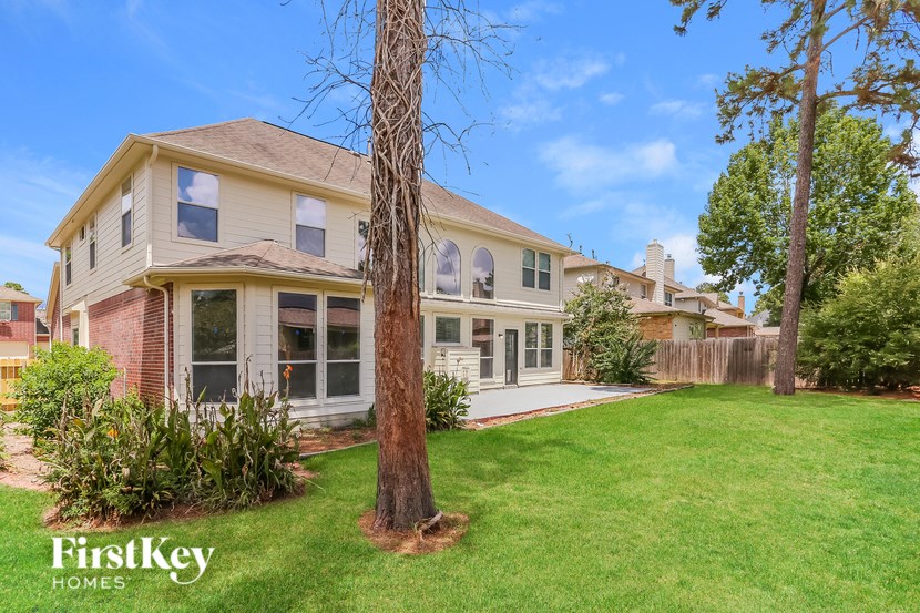 A house with a tree in front of it.