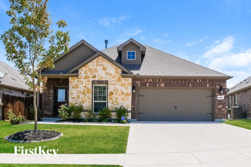 a house with a driveway and a garage door