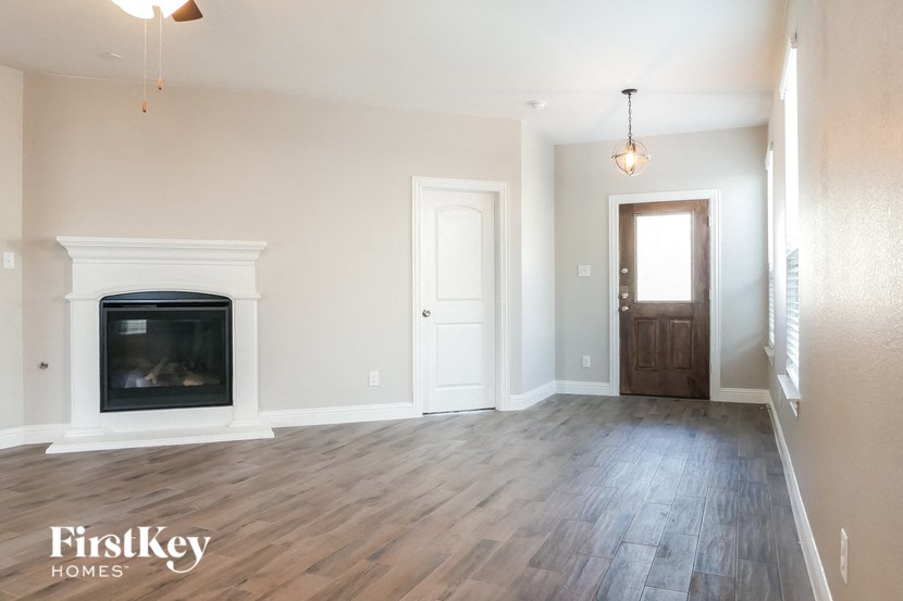 the living room of a house with a fireplace