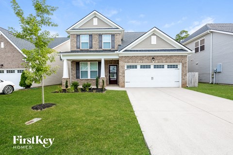 a house with a white garage door in front of it