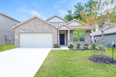 a house with a driveway and a garage door