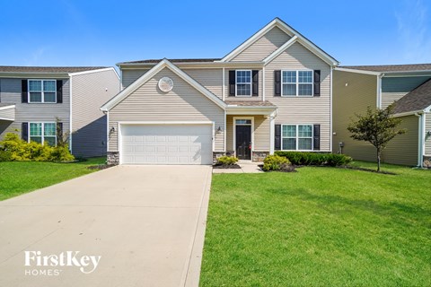 A house with a garage is for sale by FirstKey Homes.