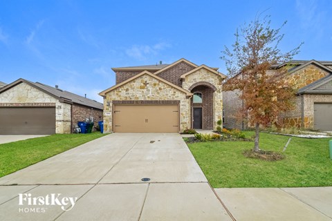 A house with a garage is for sale by FirstKey Homes.