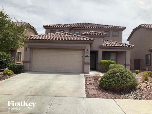 a house with a driveway and a garage door