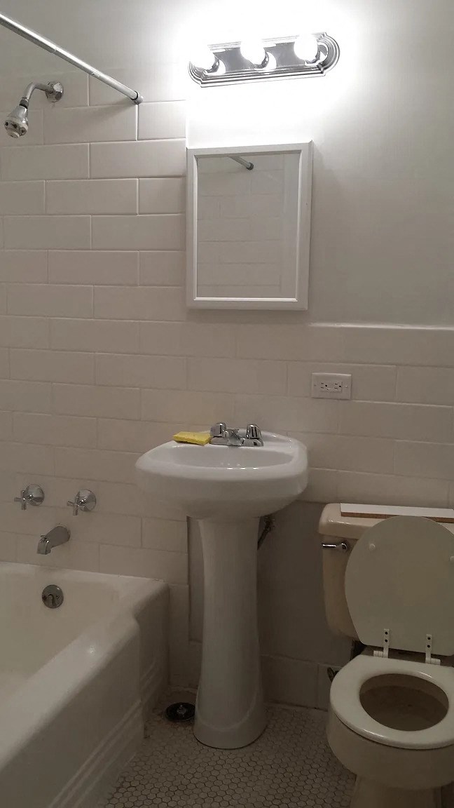 a white bathroom with a sink and a toilet
