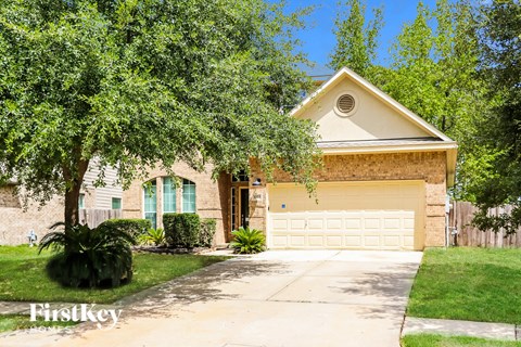 A house with a garage is for sale.