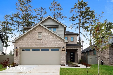 a tan brick house with a gray garage door