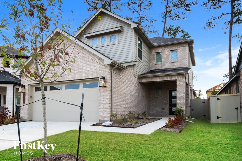 a white brick house with a white garage door
