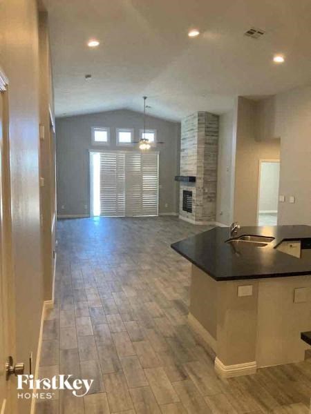 an empty kitchen and living room in a house