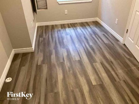 a hardwood floor in a room with a wooden floor