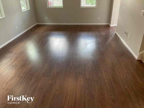 a living room with a hard wood floor