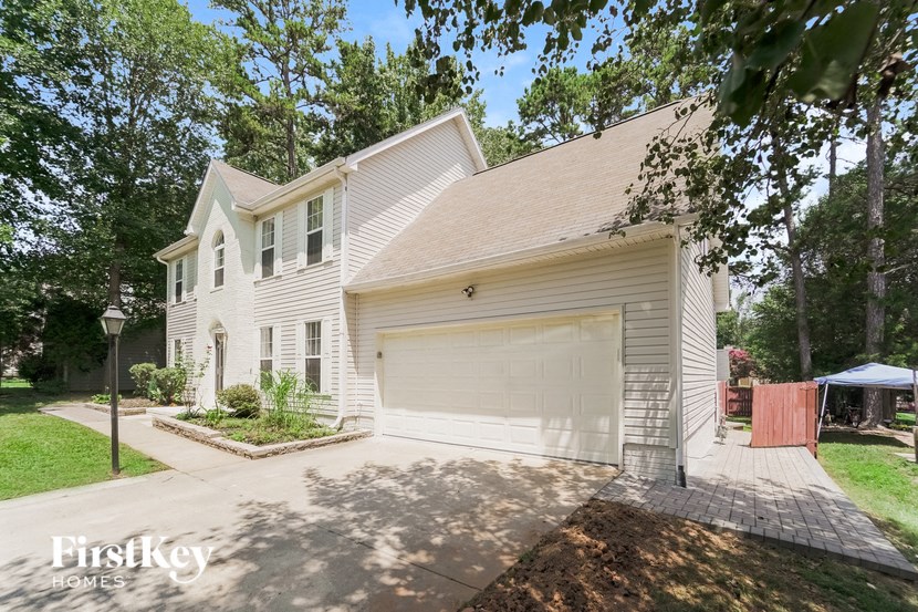 a white house with a white garage door