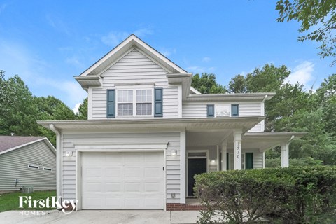 a white house with a white garage door