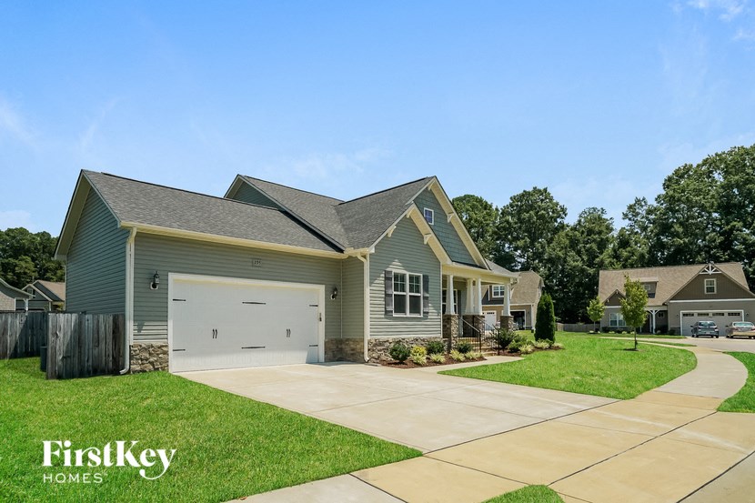 a home with a garage and a lawn