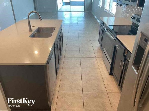 a kitchen with a sink and a counter top