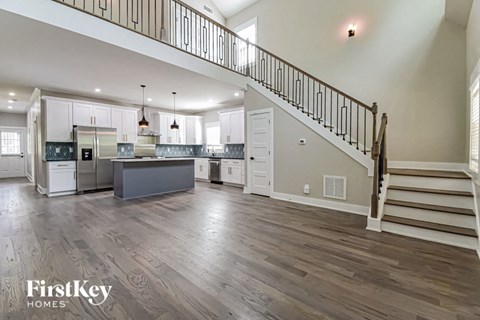 the kitchen is open to the living room and dining room