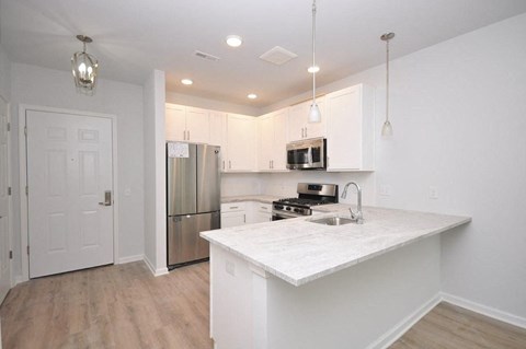a kitchen with a counter top and a refrigerator