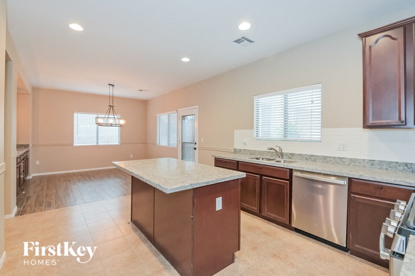 A kitchen with a FirstKey Homes logo.