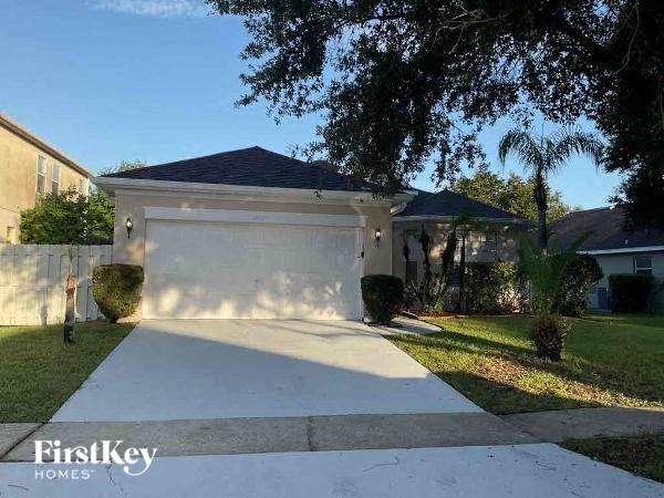 A house with a driveway and a garage door.